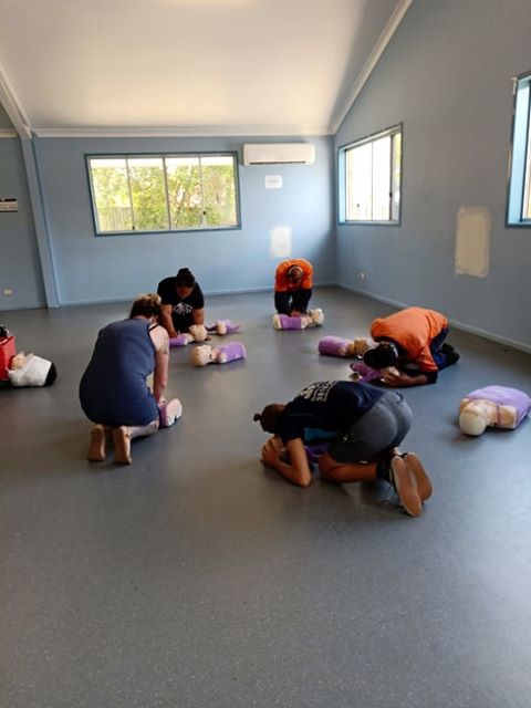 Students at our community course @ Camira/Springfield, practicing their CPR techniques.