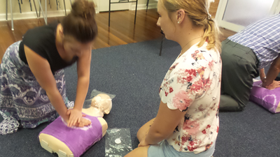 Two people take over technique for CPR training @ a community course for B-Ready First Aid, Brisbane